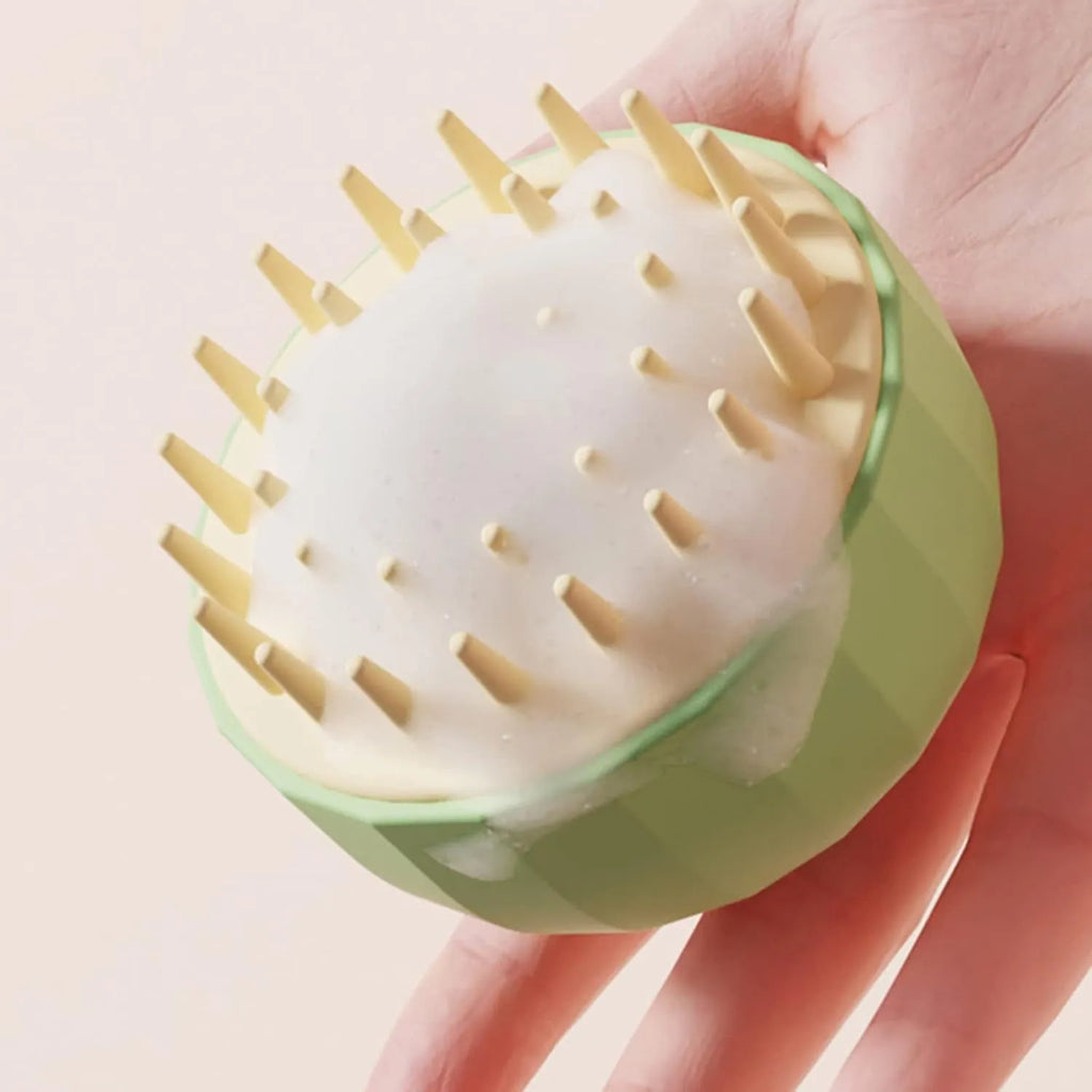Green pet bath massage brush with rubber head and drain holes for dog and cat washing