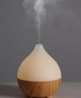 Wood grain finish vase-shaped USB aroma diffuser with 100ml water tank.