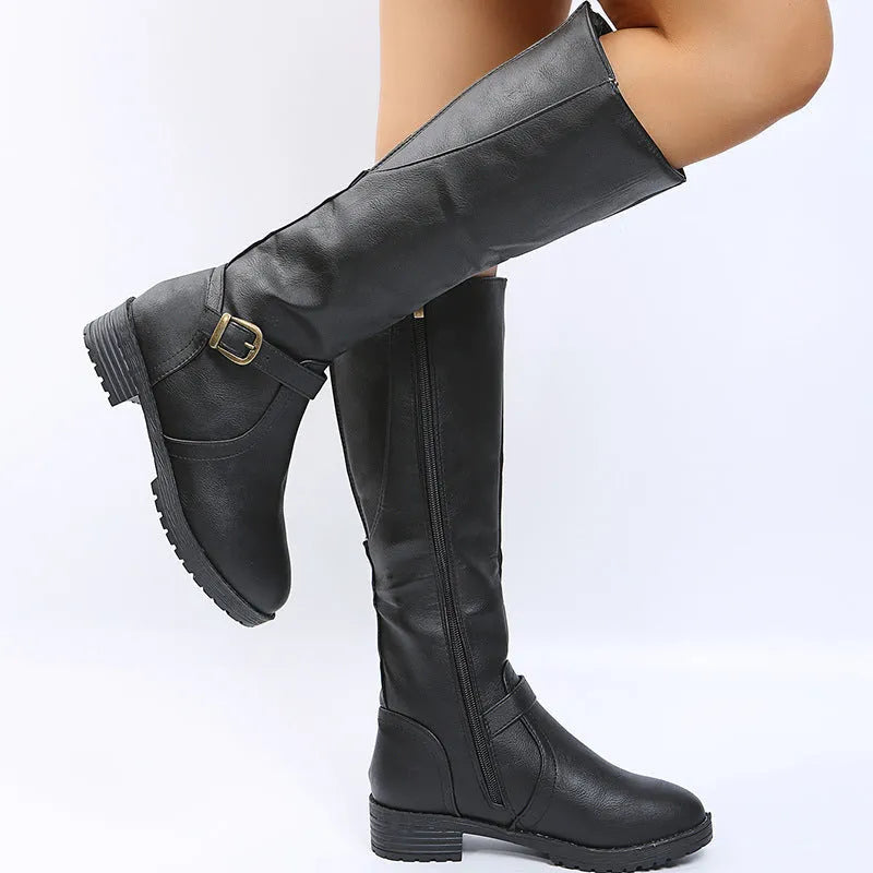 Women's black knight boots with a square heel, buckle detail on the upper, and a high shaft.