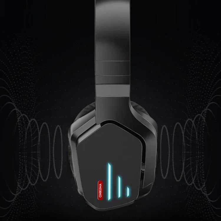 Luminous black wireless over-ear gaming headphones shown with a 3.5mm audio cable and dust bag.