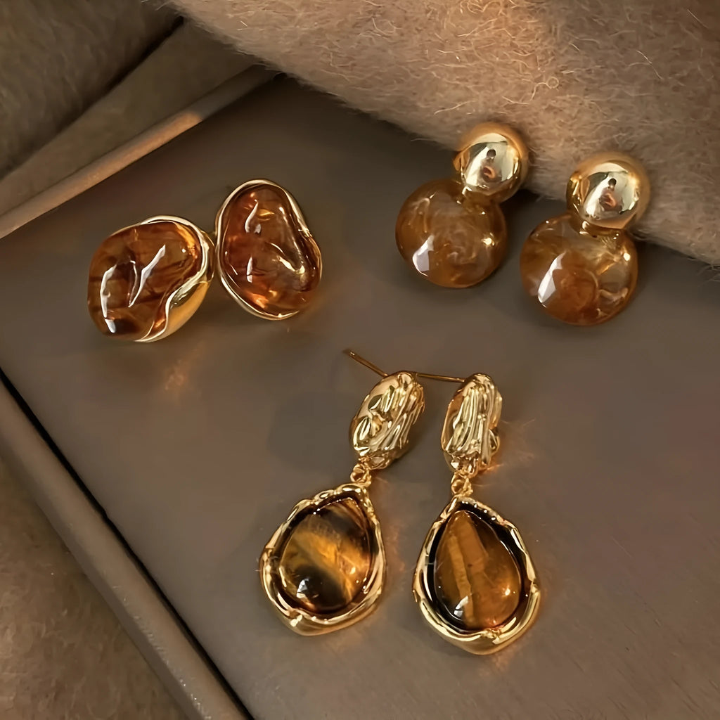 Handmade geometric tassel earrings in three electroplated styles: round piece, irregular, and water drop designs