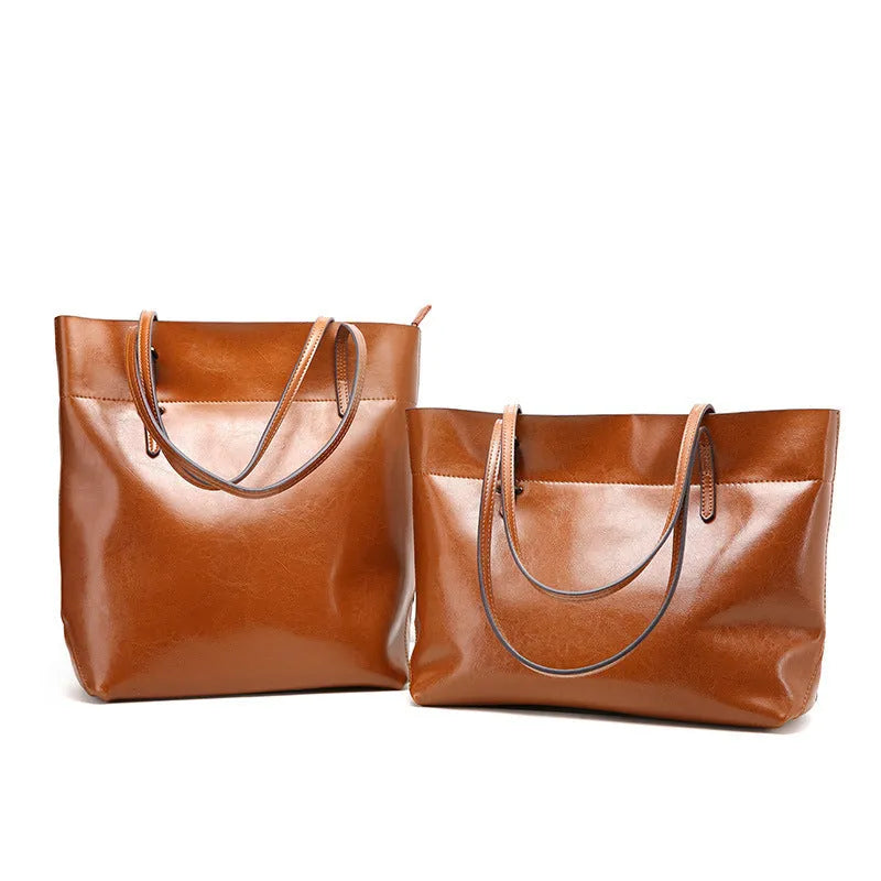 Waxed cowhide leather handbag showing horizontal cross-section opening and internal compartments
