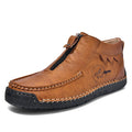 Men's black slip-on loafers with a round toe and rubber sole, shown in a casual style.
