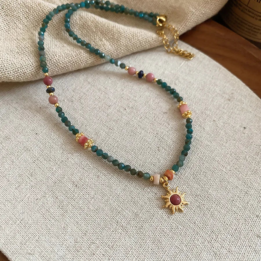 Freshwater pearl necklace with geometric sun stone pendant on adjustable clavicle chain