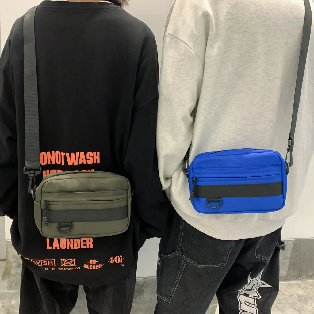 Men's street style messenger bag in solid colour with crossbody strap and nylon construction