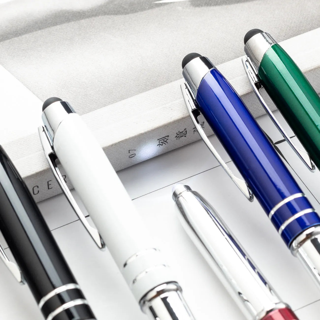 Multifunctional metal capacitive stylus pen with LED light in five colour options showing bullet type tip
