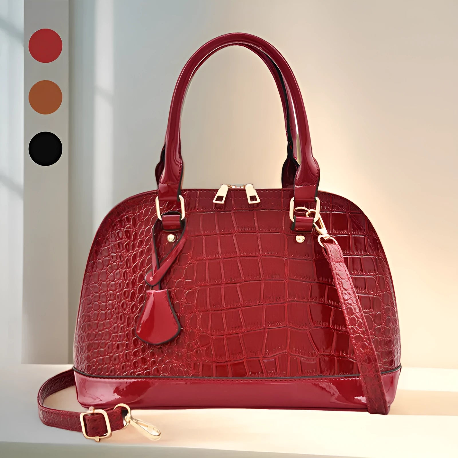 Large shiny PU leather crossbody bag in shell shape design showing black colour option