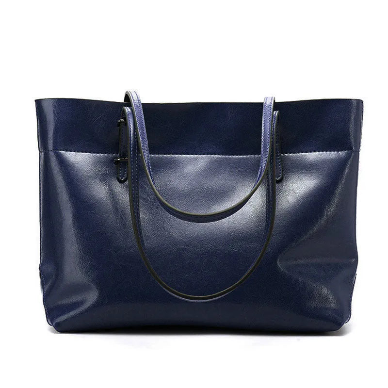 Waxed cowhide leather handbag showing horizontal cross-section opening and internal compartments