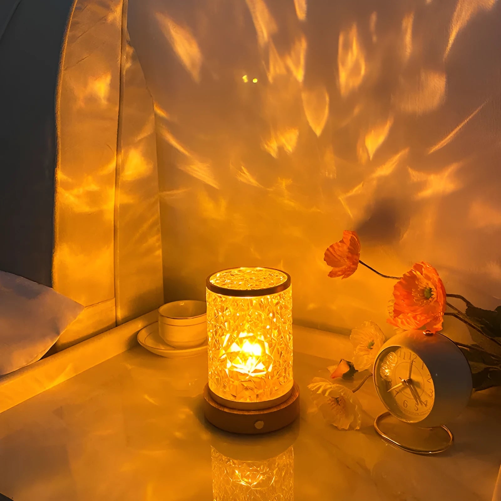 Small rotating water ripple night light on a solid wood base with touch control.