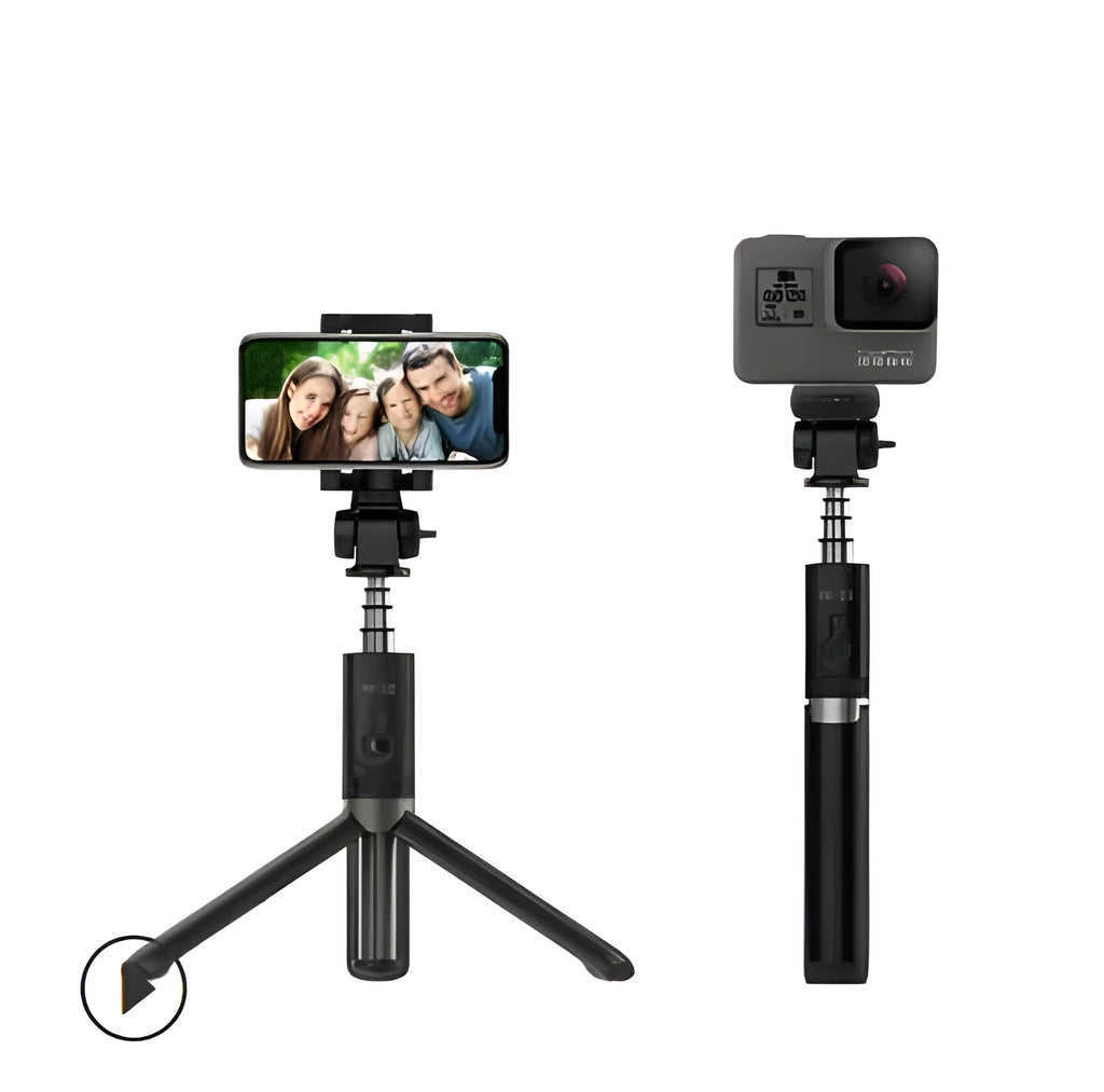 Bluetooth selfie stick tripod with remote control extended with smartphone attached