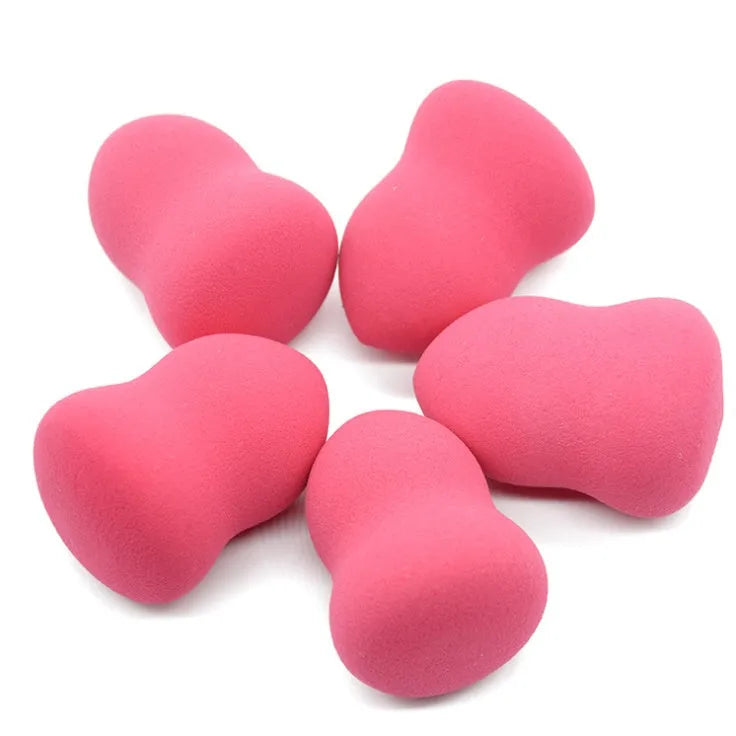 Pink hydrophilic non-latex makeup sponge for foundation, shown for scale at 4cm by 4cm by 5.6cm.