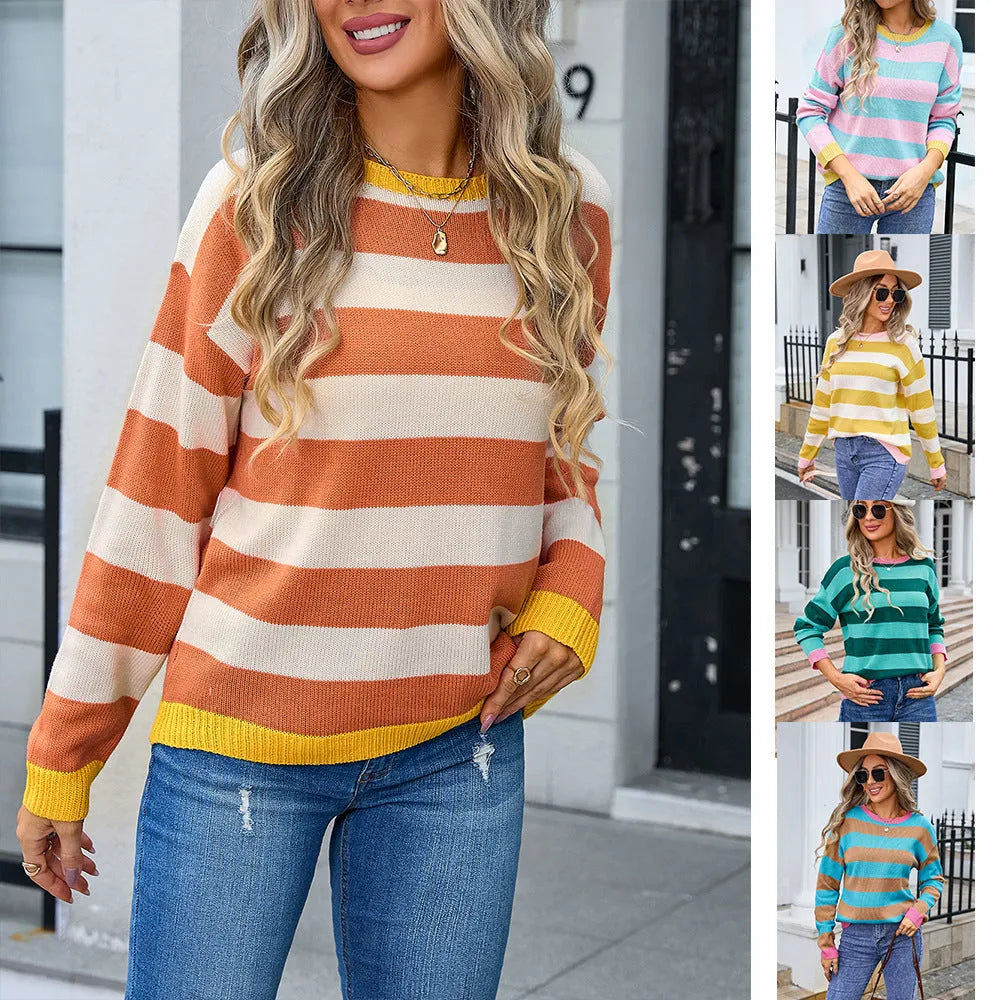 Women's loose blue acrylic sweater with flower pattern, round neck and long sleeves.
