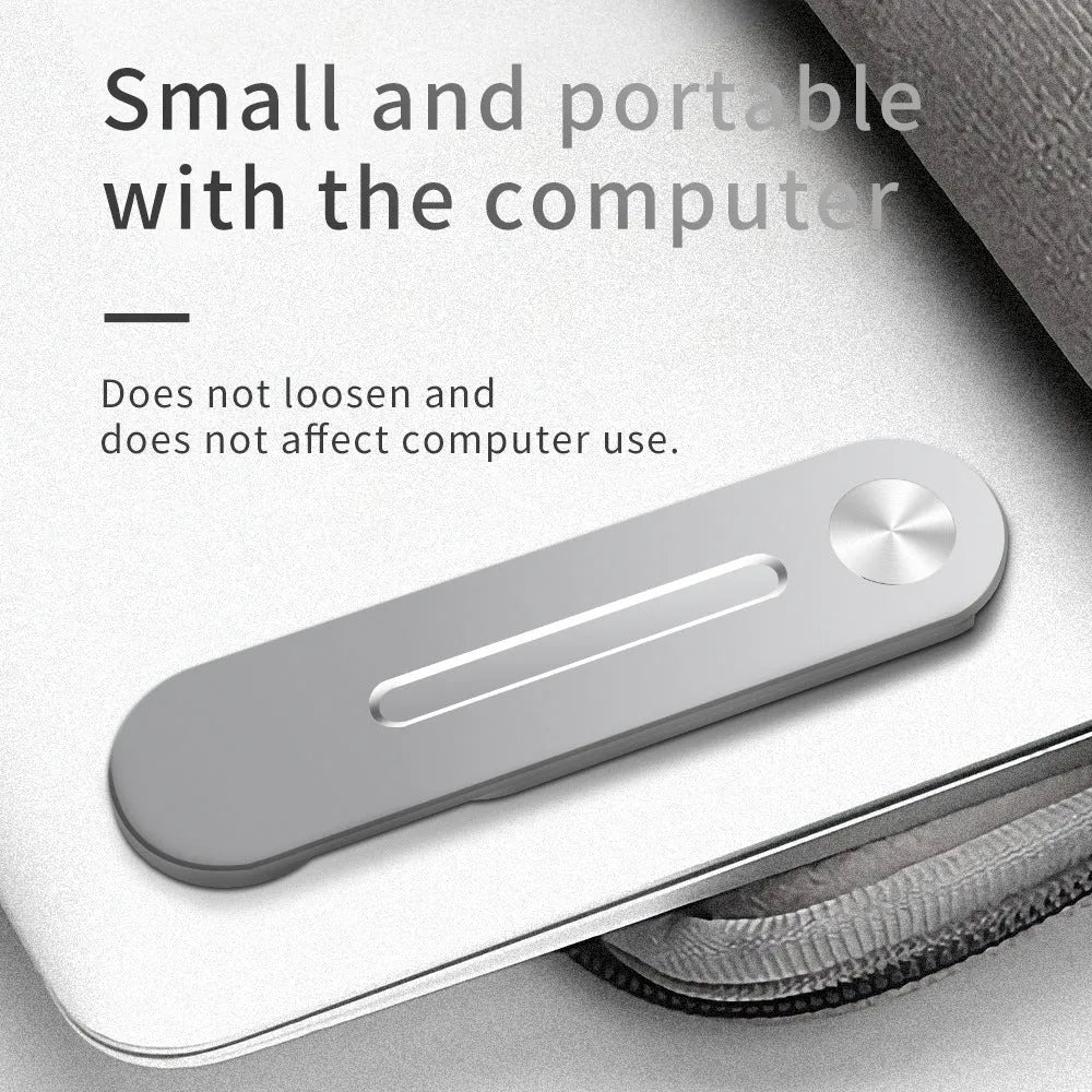 Aluminium laptop side mount bracket holding a mobile phone next to a computer screen.