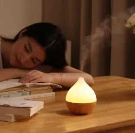Wood grain finish vase-shaped USB aroma diffuser with 100ml water tank.