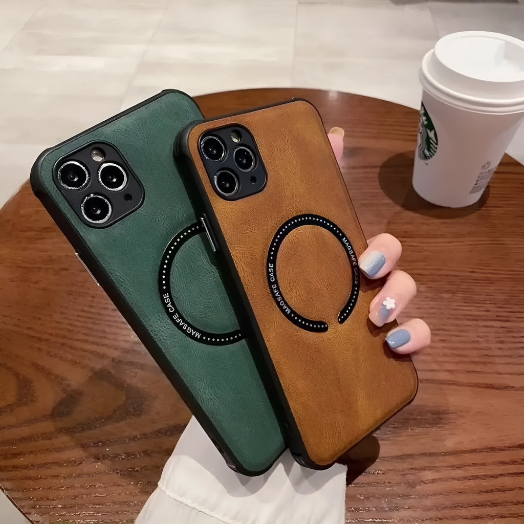 Black imitation leather magnetic charging case for Apple iPhone on a wireless charger.