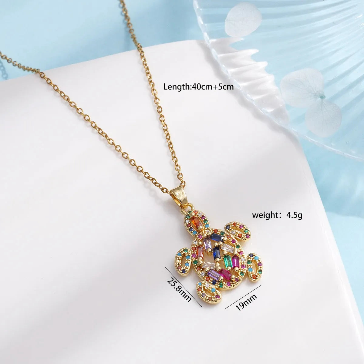 Gold-plated copper sea turtle necklace with zirconium-encrusted inlay on a titanium steel O-link chain