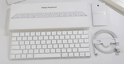White Apple Bluetooth wireless keyboard with ultra-thin metal construction and multimedia function keys
