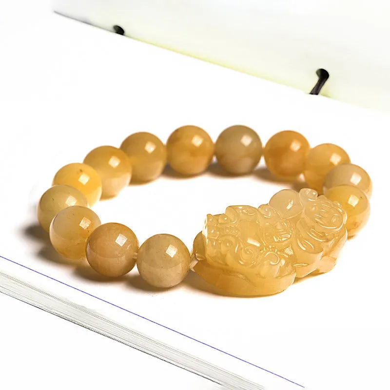 Hand-carved Jinsi Jade money bracelet showing golden thread colour, available in large or small sizes with different bead diameters.