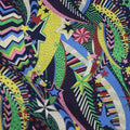 Blue cotton fabric with digital floral printing showing plant designs
