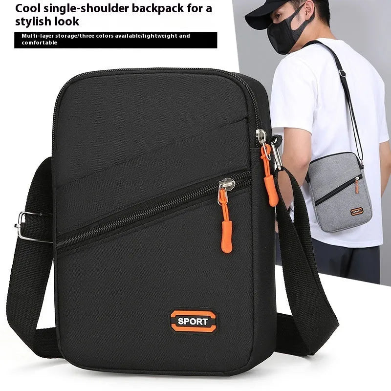 Ultra-light Oxford cloth crossbody commuter bag in solid colour with contrast trim.