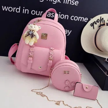 Women's three-piece PU leather bag set showing backpack, shoulder bag, and card holder in floral design.