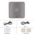 Black wireless CarPlay adapter module and silver Android Auto adapter with USB-C cables on a grey background.