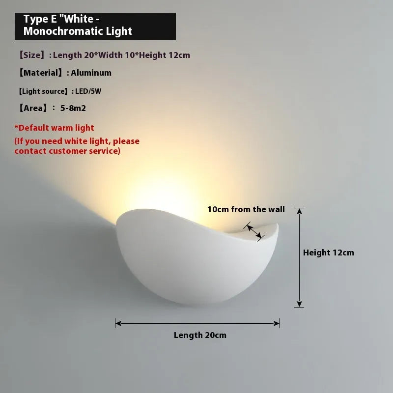 Black bird's nest design LED courtyard lamp with IP65 waterproof rating on a garden wall.