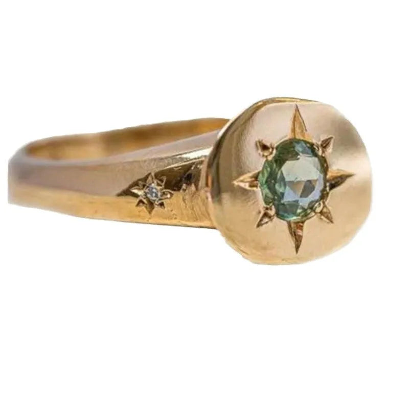 Gold zinc alloy ring with oval asterism zircon star and adjustable opening