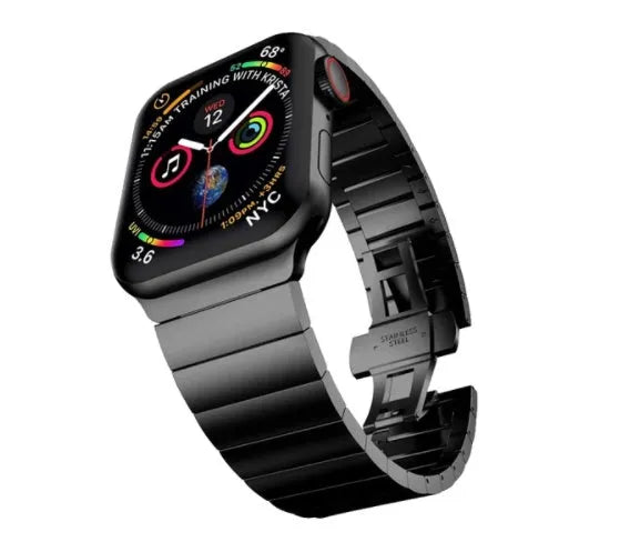 Silver stainless steel Apple Watch strap with butterfly buckle on a wrist.