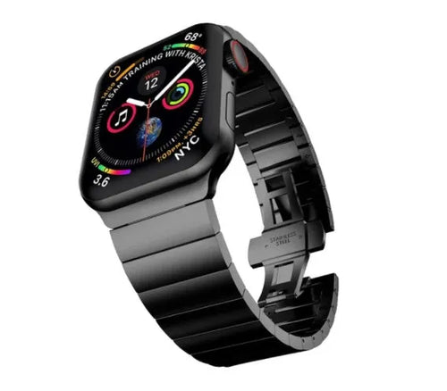 Silver stainless steel Apple Watch strap with butterfly buckle on a wrist.