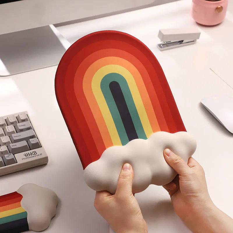 Silicone wrist rest and keyboard support mat set with printed white cloud pattern on a desk.