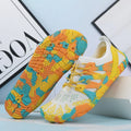 Quick-drying lace-up wading shoes in multiple colours with mesh upper and textured rubber sole.