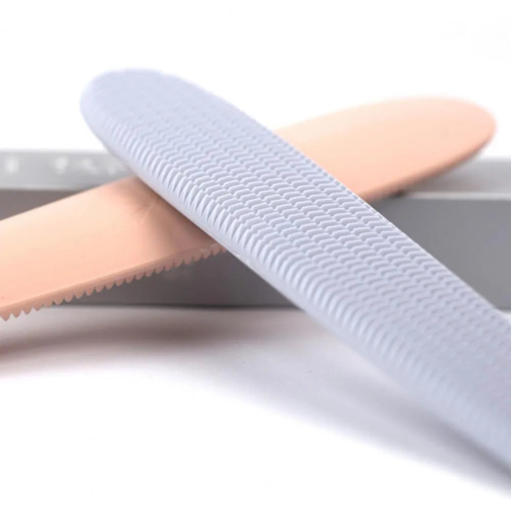 Grey dual-ended cat grooming comb with wide and narrow sections for pet hair removal and massage
