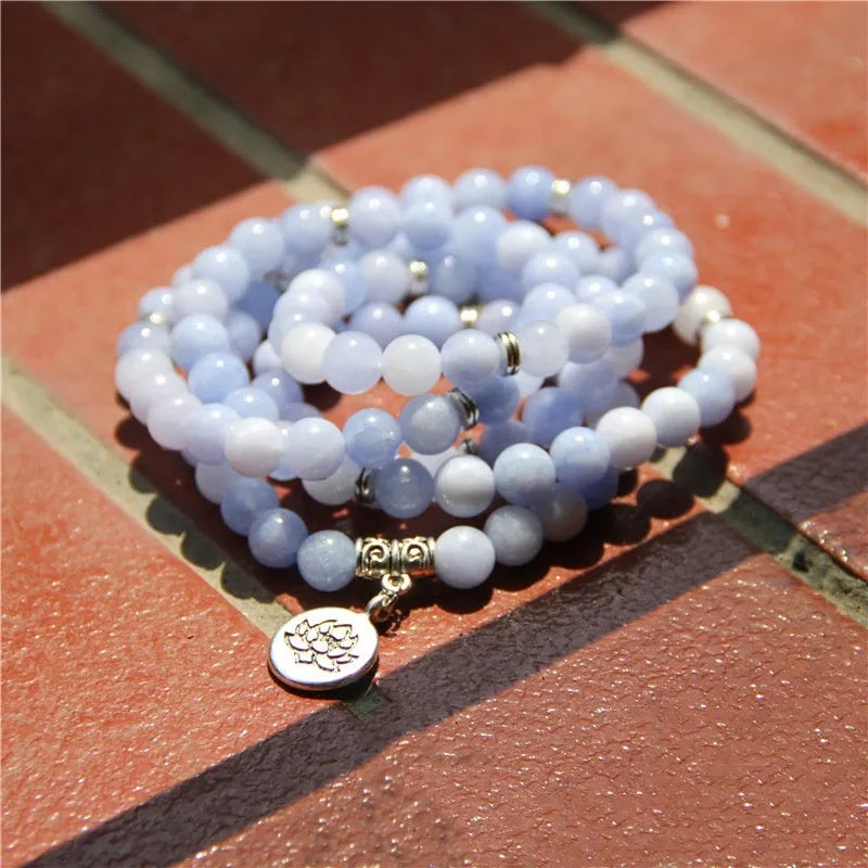 A women's vintage bracelet made of natural stone featuring a lotus geometry design.
