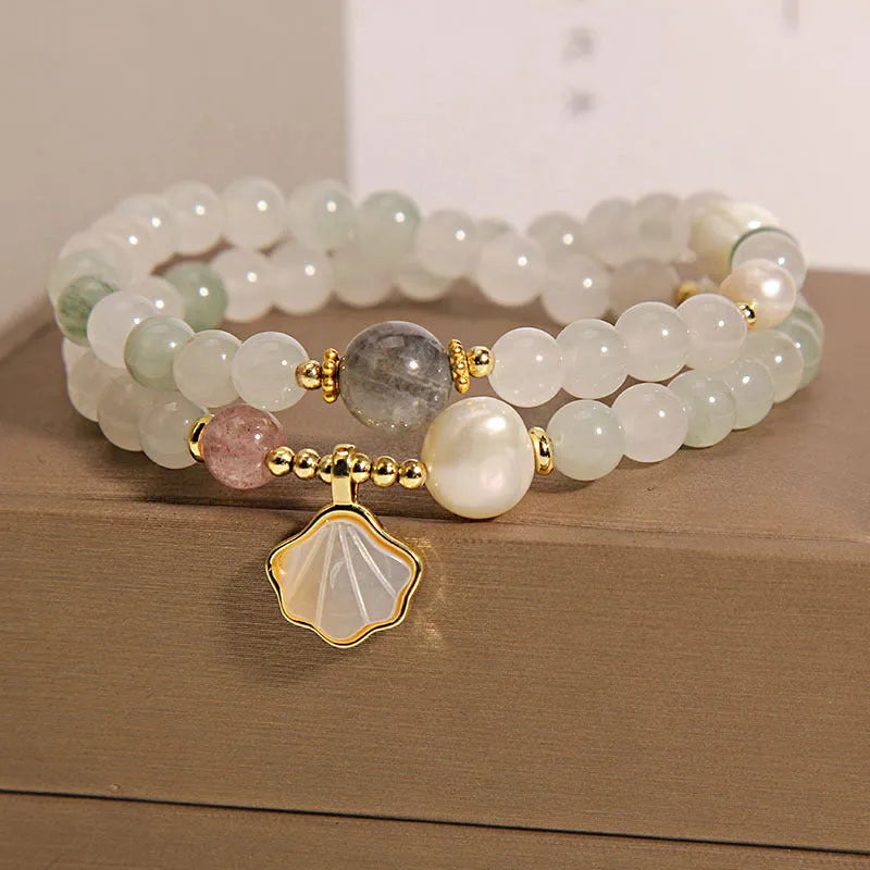 Gold-plated crystal bracelet for women with a Tianshan jade green ginkgo leaf pendant and rhinestones.