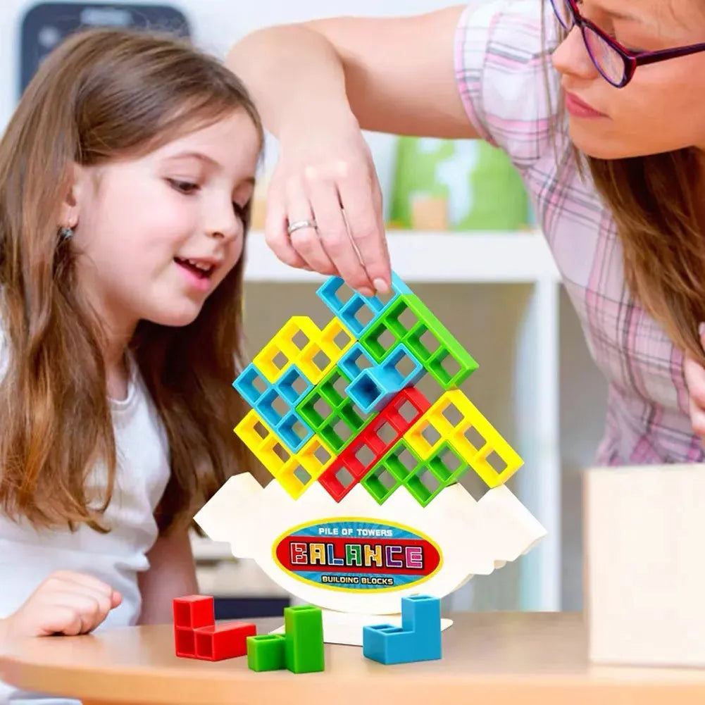 Plastic balance stacking board game with 16 colourful blocks on chassis and base