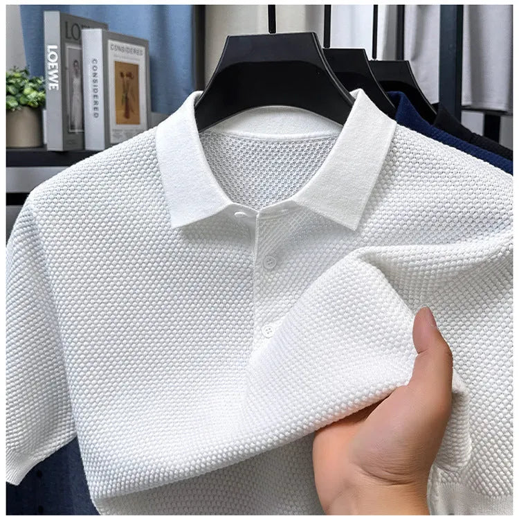 A loose-fitting short sleeve cotton pullover sweater on a hanger, shown in one of the six available colours.