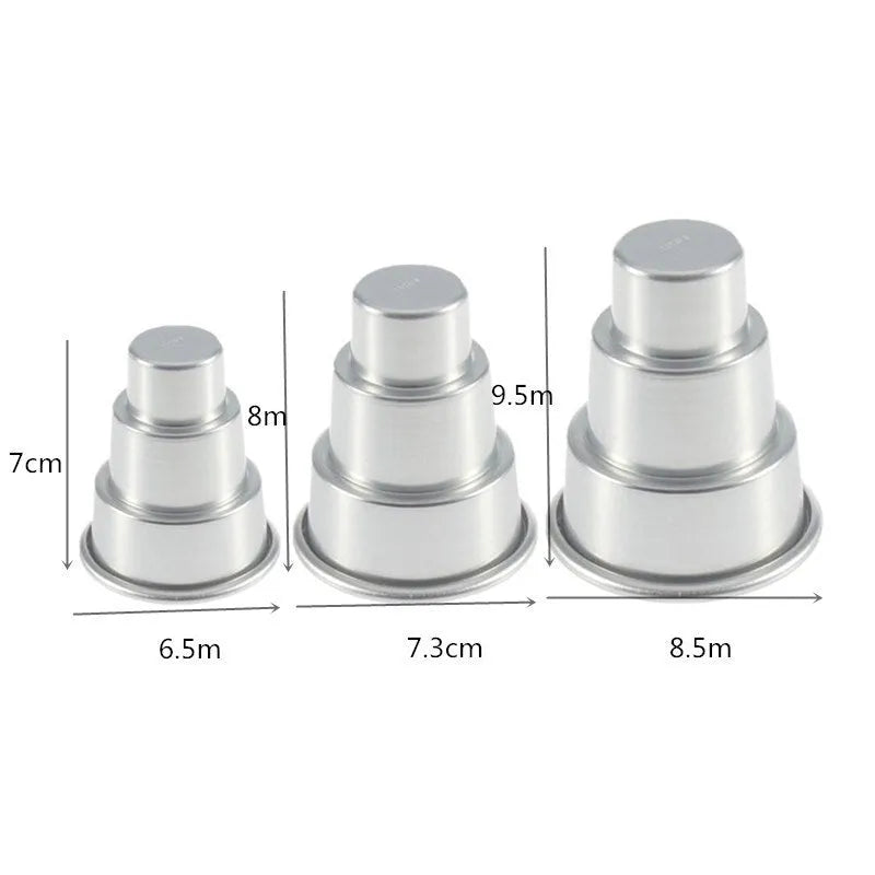 Set of three silver aluminium alloy round cake moulds in large, medium, and small sizes.