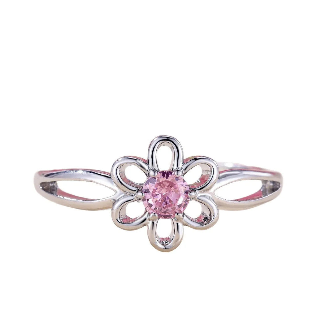 Close-up of a ladies floral hollow ring in electroplated copper with a platinum pink diamond finish.