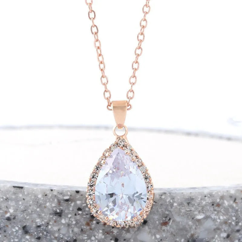 Drop shape women's necklace with rose gold electroplating and rhinestone geometric design in pink colour
