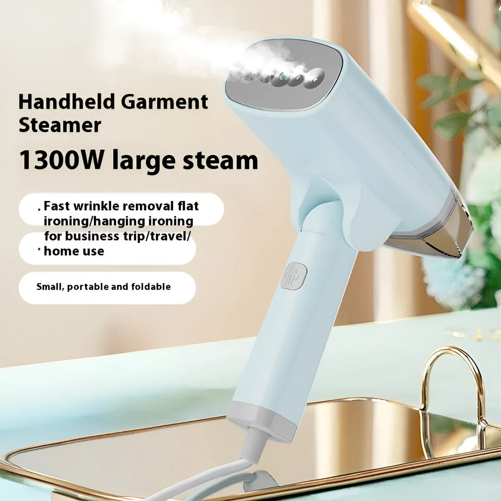 Blue and white handheld garment steamer with hanging iron attachment on wooden surface