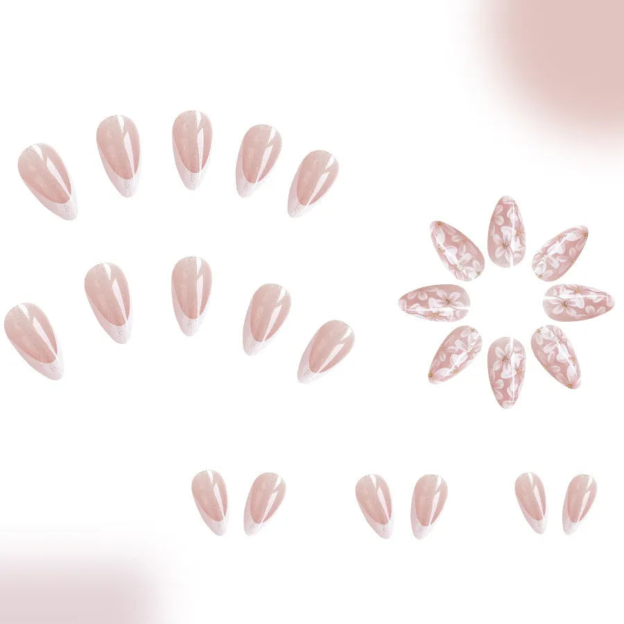 Short almond-shaped false nails with French style base and glitter powder flower decoration, colour C625.