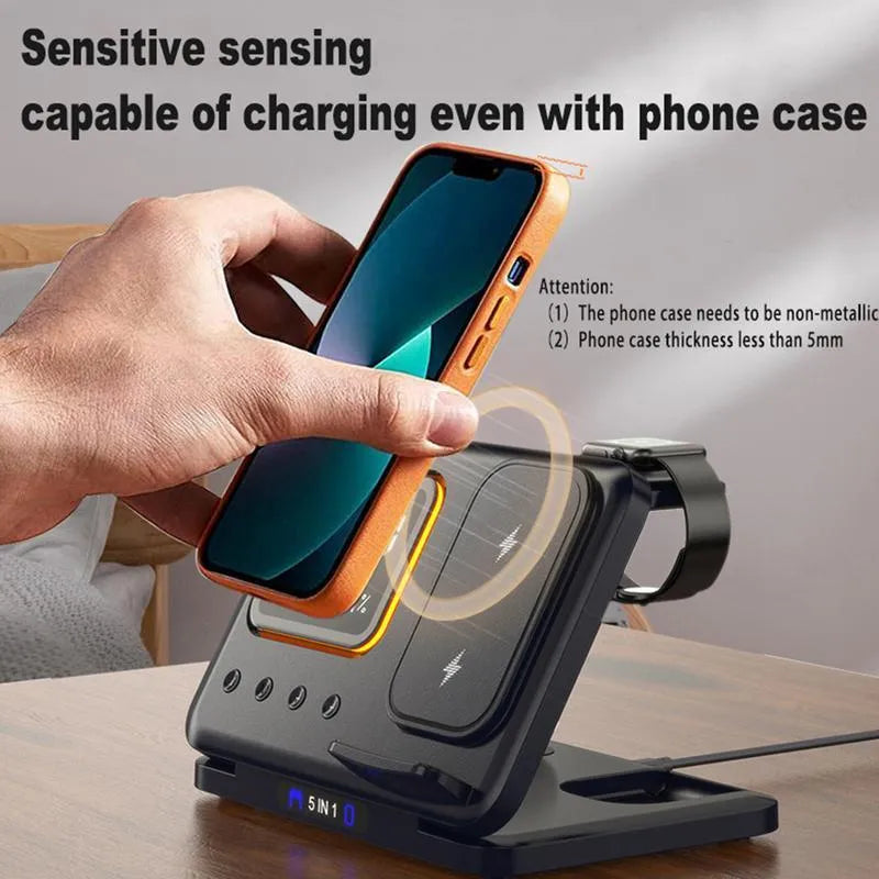 Black wireless charging station with digital clock displaying time and temperature charging phone and watch