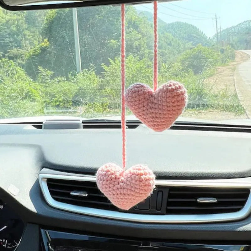 Green and white knitted wool car plant decoration with plastic base and hanging rope