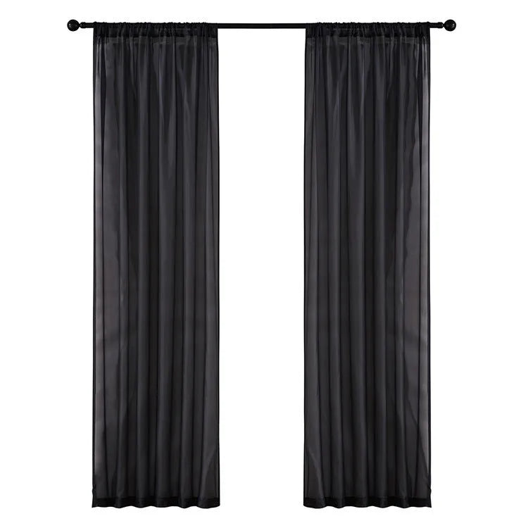 Modern simple black cotton linen vertical perforated curtain hung on a window.