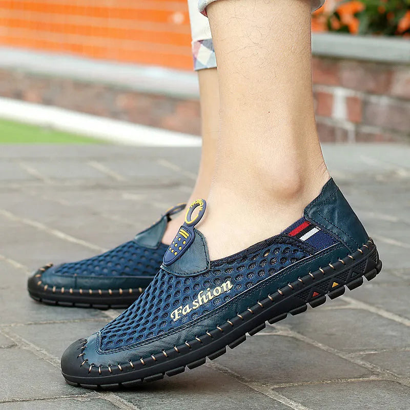Men's brown casual mesh shoes with a round toe and stitched rubber sole on a plain background.