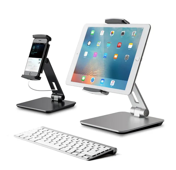 Silver foldable aluminium tablet phone holder showing 360-degree rotation mechanism and silicone anti-slip pads