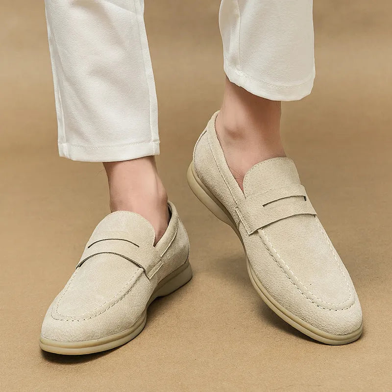 Men's black leather slip-on shoes with round toe and rubber sole on a white background