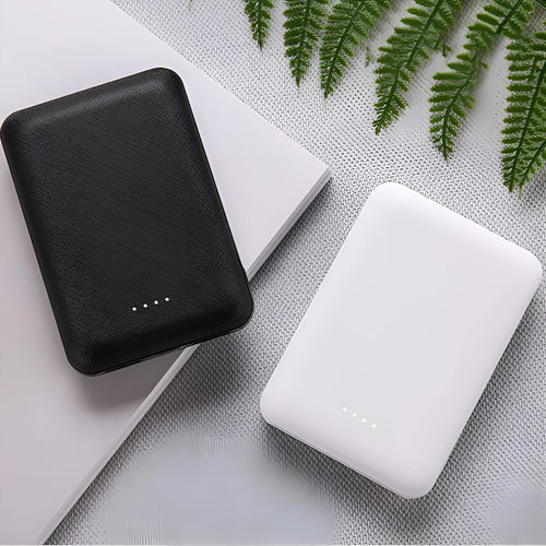 Black and white 10,000mAh ultra-thin power bank with multiple USB ports