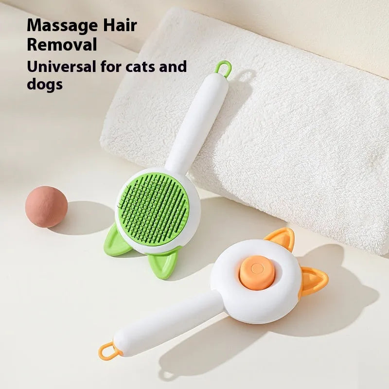 A greenish white and orange cat grooming comb with stainless steel teeth and a self-cleaning button.